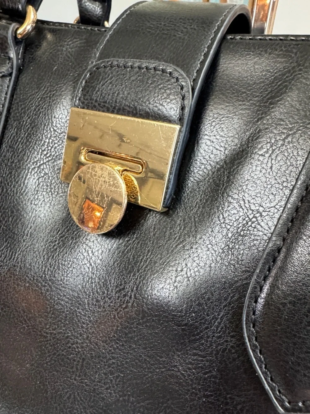 Women's Black Leather Satchel with Gold-Tone Lock and crossbody strap EUC